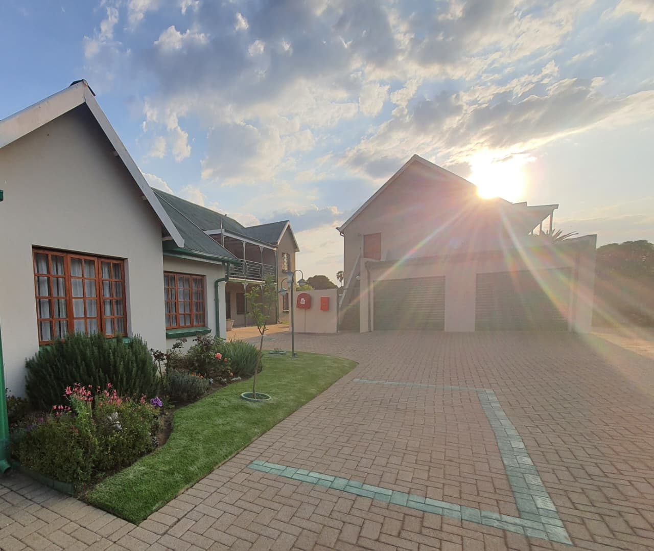 The paved driveway at sunset